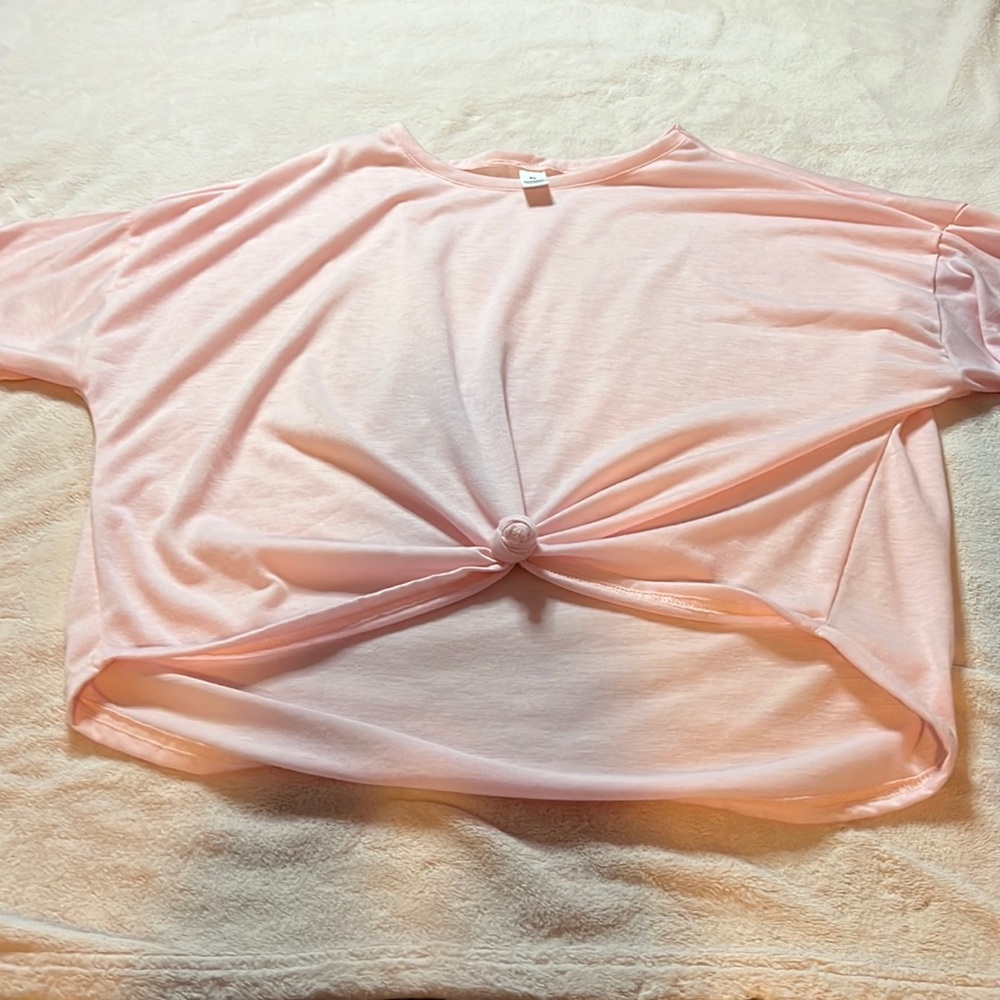 Short sleeve, kind of cropped, never worn pink T-shirt, extra large